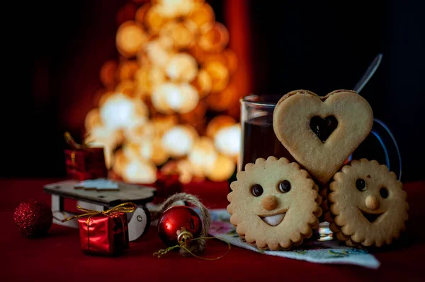 christmas decoration conceptual photo with a mug of tea and cookies