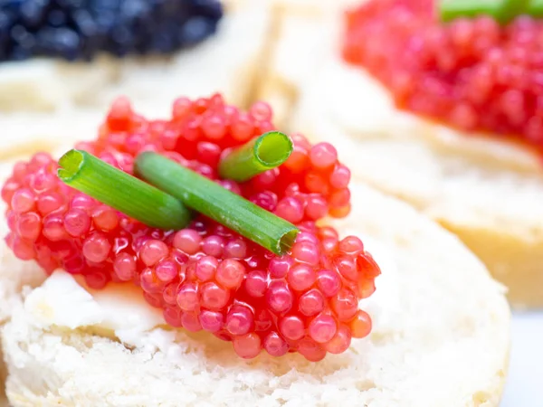 delicious sandwiches with fish roe caviar, close up