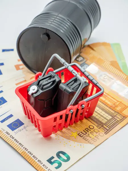 oil barrel and fuel canisters on euro bills, concept photo of oil high prices
