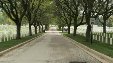 Memorial Day Veterans Cemetery. Arlington National Cemetery panning shot at sunset. america Christian Cemetery pan, Catholic faith white stone tomb. 