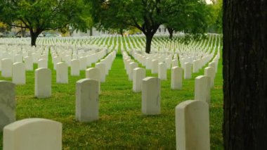 Memorial Day Veterans Cemetery. Arlington National Cemetery panning shot at sunset. america Christian Cemetery pan, Catholic faith white stone tomb. 