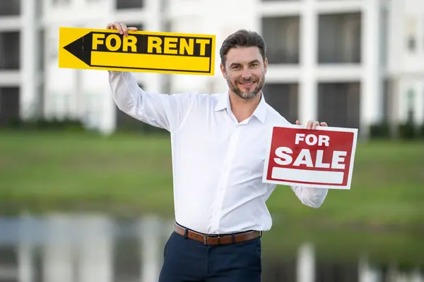 Businessman buying and selling houses and real estate. real state agent giving new house key. Estate agent with customer before contract signature. male real state agent with a for sale or rent sign.