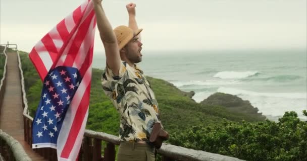 Male Traveler Holds American Flag Proudly Hiker Man Celebrates Independence — Stock Video