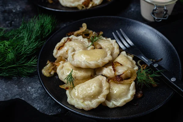 stock image Vareniki with potatoes and onions in a plate. Ukrainian food