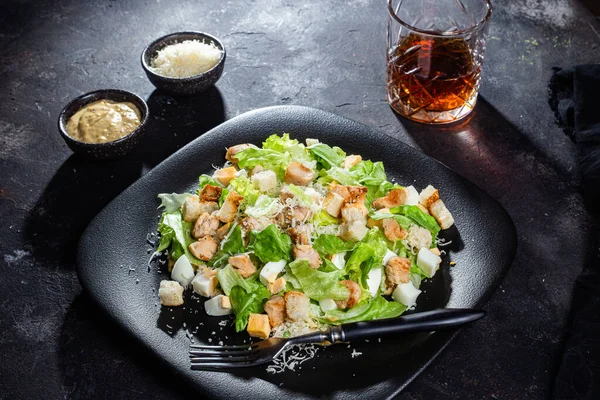 stock image Caesar salad in a plate close-up