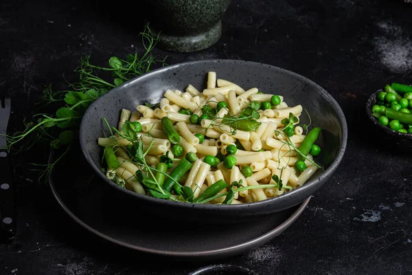 stock image Pasta with green peas and green beans in a bowl