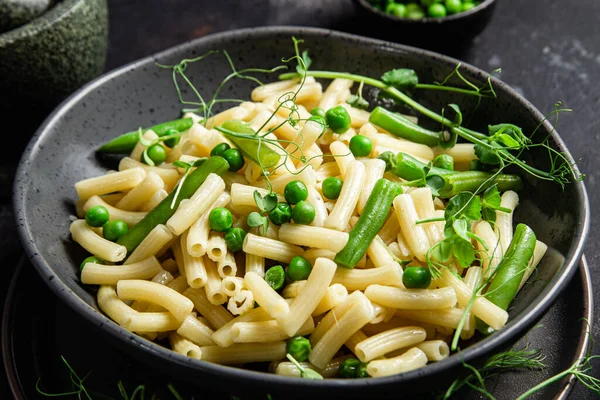 stock image Pasta with green peas and green beans in a bowl