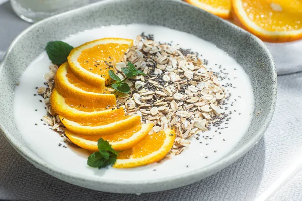 stock image Oatmeal with orange and chia in a bowl .Oatmeal