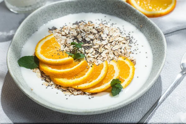 stock image Oatmeal with orange and chia in a bowl .Oatmeal