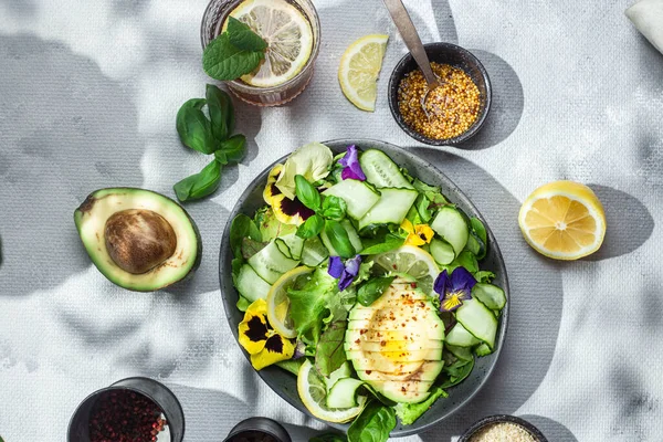 stock image Salad of greens, avocado and cucumbers .Food styling