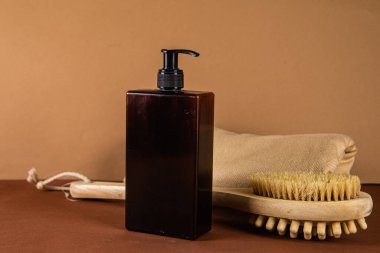 Soap dispenser on beige background close up clipart