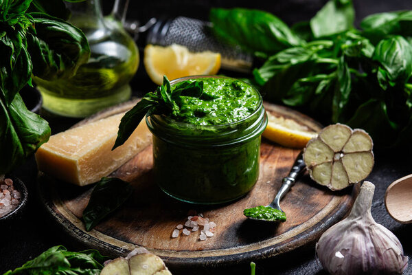 Homemade Pesto Sauce in a Jar with Fresh Ingredients