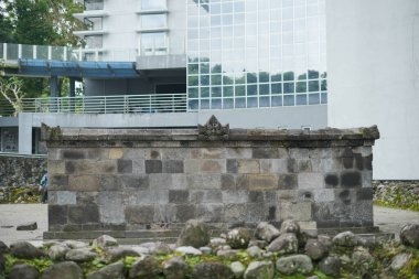 Yogyakarta, Indonesia - January 28, 2023:Candi Kimpulan (also known as Candi Pustakasala) is an ancient relic located on the campus of the Islamic University of Indonesia (UII).