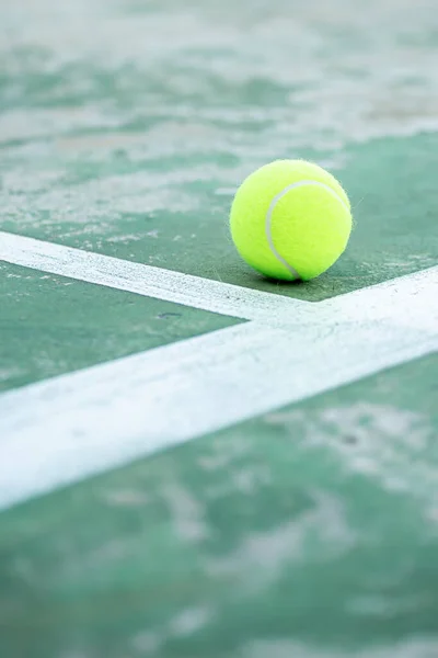 stock image tennis ball on court 