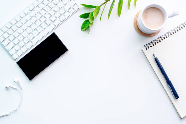 Top View of Modern Workspace with laptop on white background. Flat lay concept business design, top view office table des
