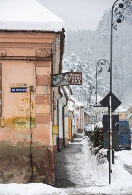 Rasnov, Romania  February 04 2023: It snowed beautifully in the medieval town of Rasnov in Romania.