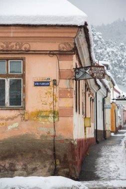 Rasnov, Romania  February 04 2023: It snowed beautifully in the medieval town of Rasnov in Romania.