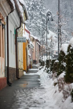 Rasnov, Romania  February 04 2023: It snowed beautifully in the medieval town of Rasnov in Romania.