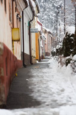 Rasnov, Romania  February 04 2023: It snowed beautifully in the medieval town of Rasnov in Romania.