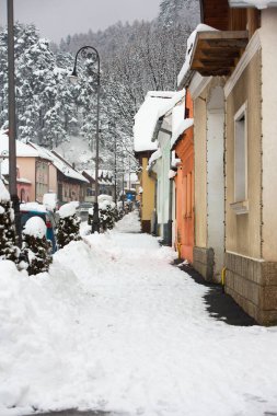 Rasnov, Romania  February 04 2023: It snowed beautifully in the medieval town of Rasnov in Romania.