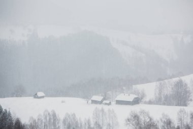 An abundant snowfall in the Romanian Carpathians in the village of Sirnea, Brasov. Real winter with snow in the country