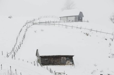 An abundant snowfall in the Romanian Carpathians in the village of Sirnea, Brasov. Real winter with snow in the country