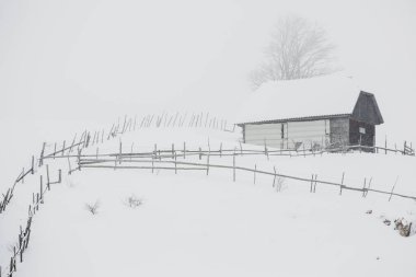 An abundant snowfall in the Romanian Carpathians in the village of Sirnea, Brasov. Real winter with snow in the country