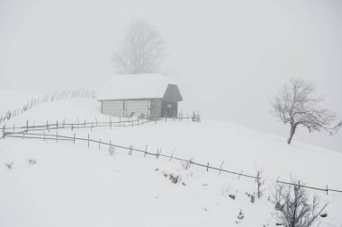 An abundant snowfall in the Romanian Carpathians in the village of Sirnea, Brasov. Real winter with snow in the country