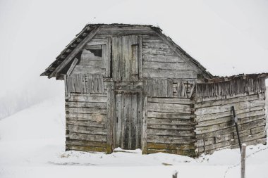 An abundant snowfall in the Romanian Carpathians in the village of Sirnea, Brasov. Real winter with snow in the country