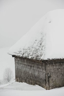 An abundant snowfall in the Romanian Carpathians in the village of Sirnea, Brasov. Real winter with snow in the country