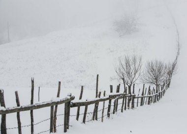 An abundant snowfall in the Romanian Carpathians in the village of Sirnea, Brasov. Real winter with snow in the country