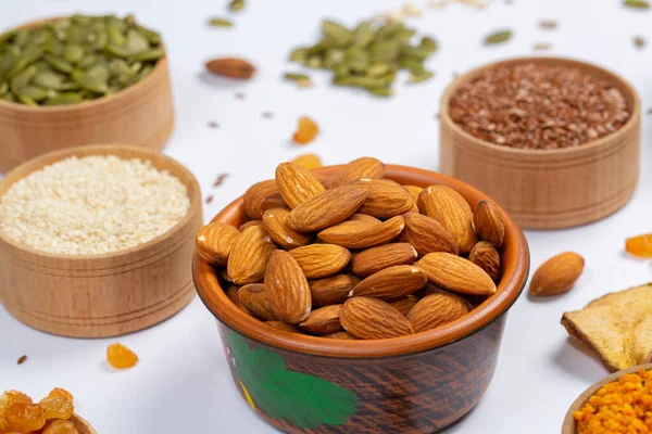 stock image Healthy vegetarian food concept. Assortment of dried fruits, nuts and seeds on white background. Top view.