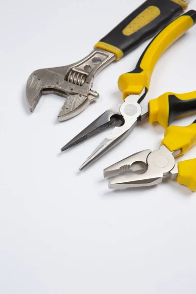 stock image Set of tools for repair in a case on a white background. Assorted work or construction tools. Wrenches, Pliers, screwdriver. Top view