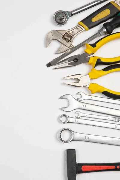 stock image Set of tools for repair in a case on a white background. Assorted work or construction tools. Wrenches, Pliers, screwdriver. Top view