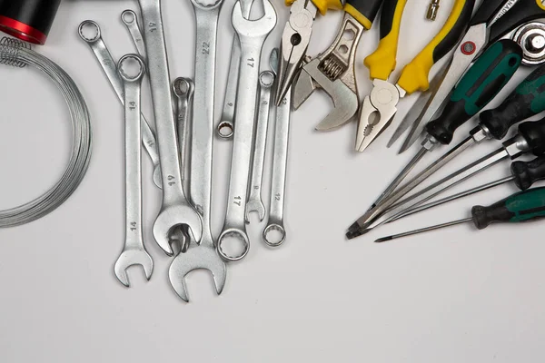 stock image Set of tools for repair in a case on a white background. Assorted work or construction tools. Wrenches, Pliers, screwdriver. Top view