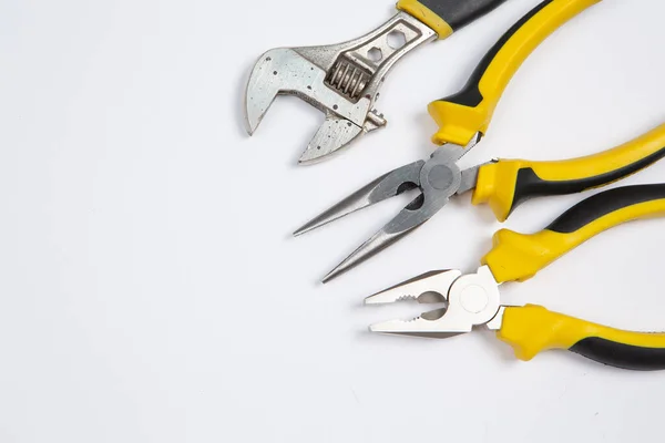 stock image Set of tools for repair in a case on a white background. Assorted work or construction tools. Wrenches, Pliers, screwdriver. Top view