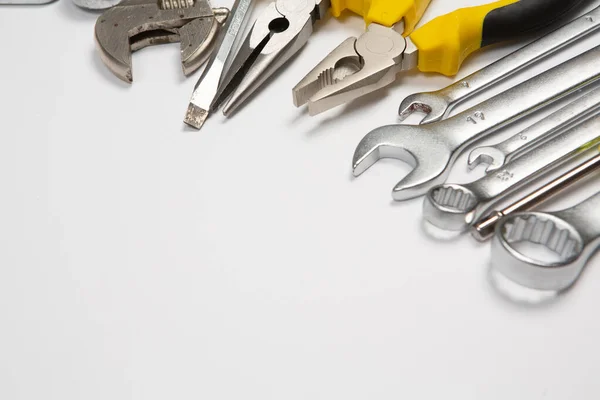 stock image Set of tools for repair in a case on a white background. Assorted work or construction tools. Wrenches, Pliers, screwdriver. Top view