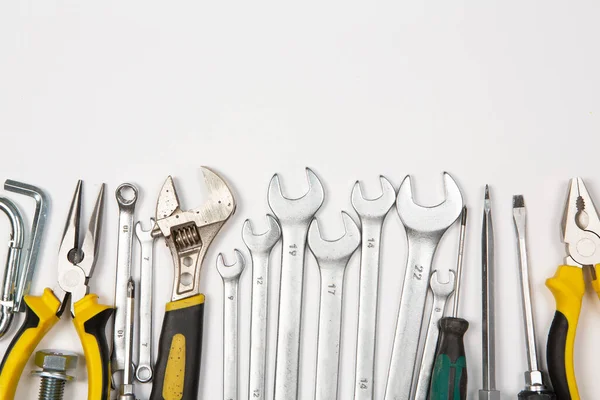 stock image Set of tools for repair in a case on a white background. Assorted work or construction tools. Wrenches, Pliers, screwdriver. Top view