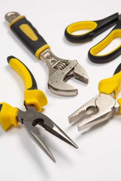 Stock image Set of tools for repair in a case on a white background. Assorted work or construction tools. Wrenches, Pliers, screwdriver. Top view