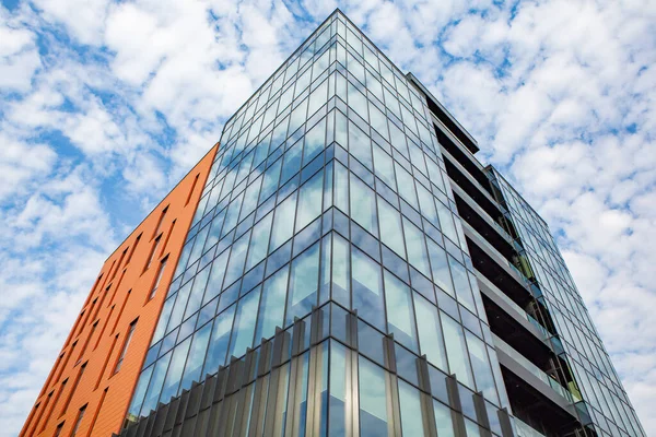 stock image Modern office building with glass facade and blue sky. Business background. modern architecture in the city