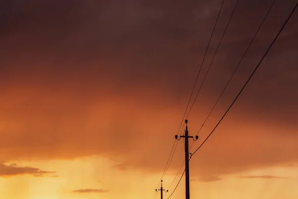 stock image High-voltage power lines at sunset. Electricity distribution station. electricity pylons on the background of the sky