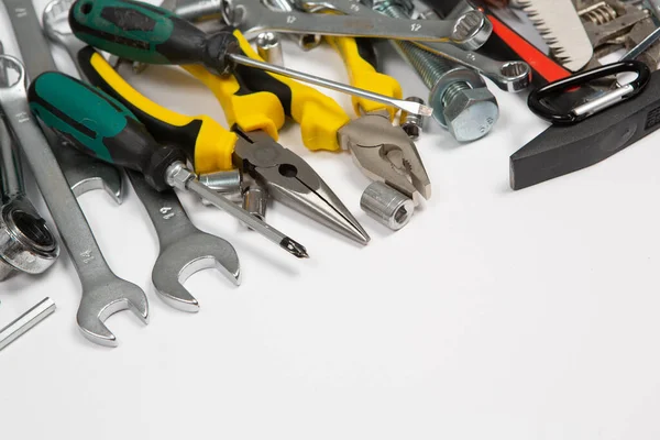 stock image Set of tools for repair in a case on a white background. Assorted work or construction tools. Wrenches, Pliers, screwdriver. Top view