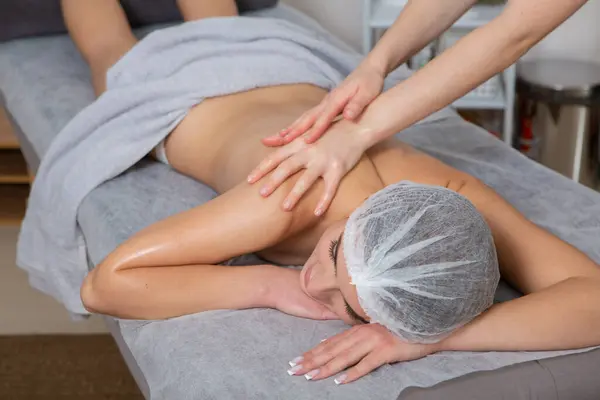 Detox, beauty and massage with woman in spa for wellness, luxury and treatment. Skincare, peace and zen with female customer and hands of therapist for physical therapy, salon and relax