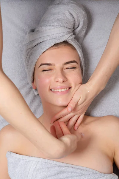 Beauty and massage with woman in spa for wellness, luxury and treatment. Skincare, peace and zen with female customer and hands of therapist for physical therapy,