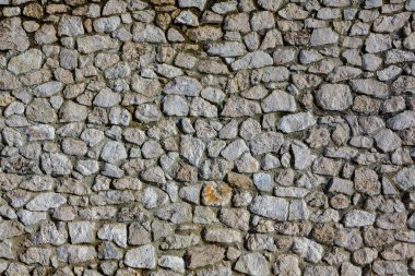 Taş duvar dokusu fotoğrafının arka planı. Taş duvara yakın çekim.