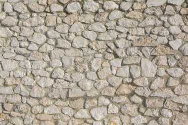 Taş duvar dokusu fotoğrafının arka planı. Taş duvara yakın çekim.