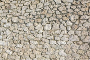 Taş duvar dokusu fotoğrafının arka planı. Taş duvara yakın çekim.