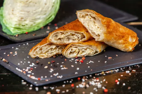 Traditional fried pies from Romania with potatoes, cheese and cabbage. Romanian food.