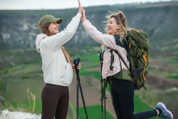 Two Young Women Friends Hikers Backpacks Trekking Poles Top Mountain — Stock Photo, Image