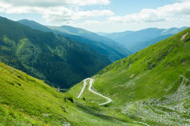 Photo with very picturesque transfagarasan mountain road in the Carpathians, Romania clipart